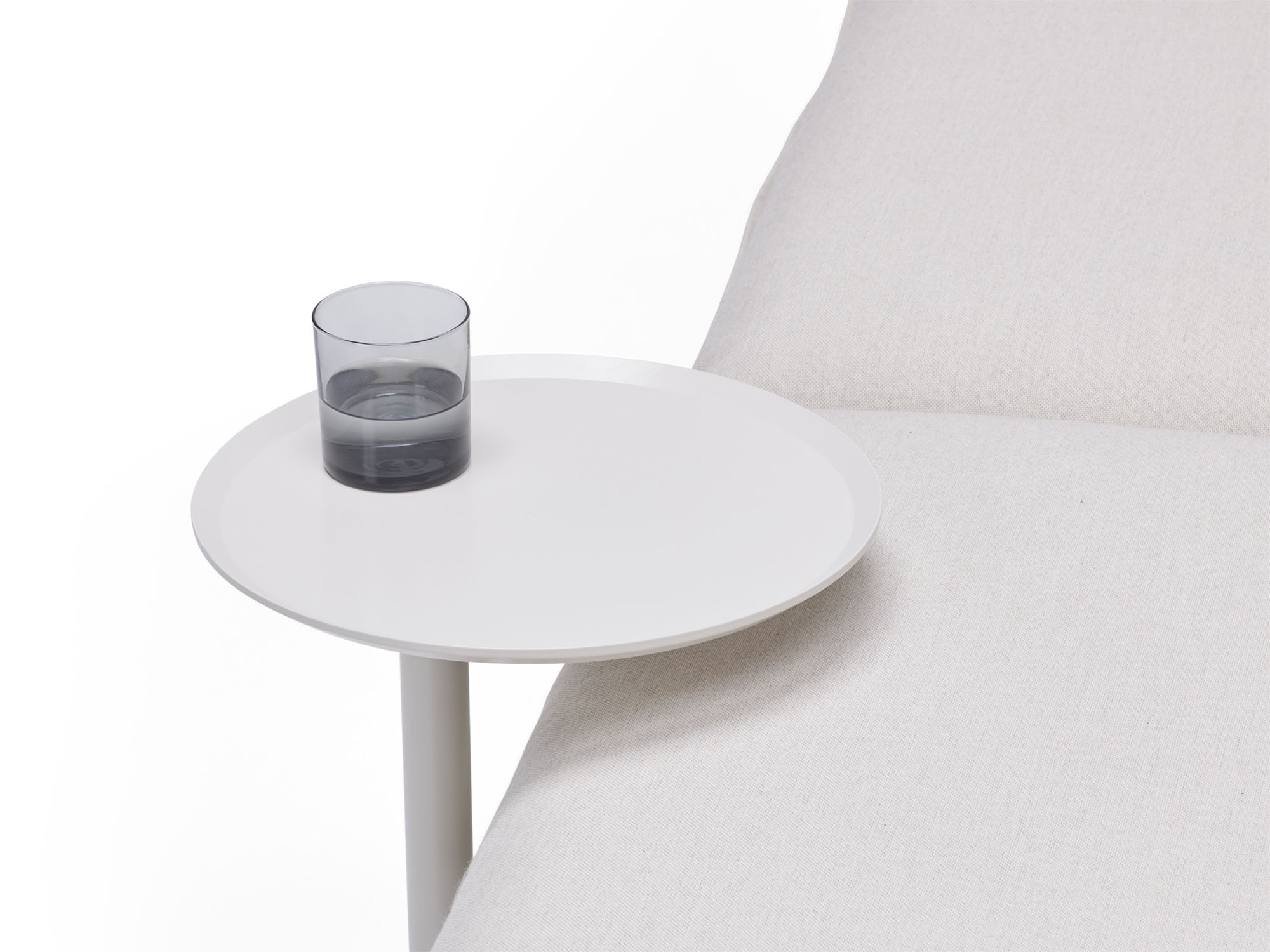 Detail view of white metal outdoor side table